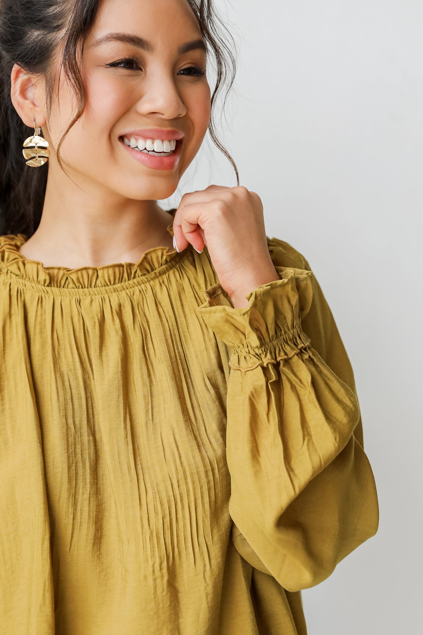 Blouse in mustard close up