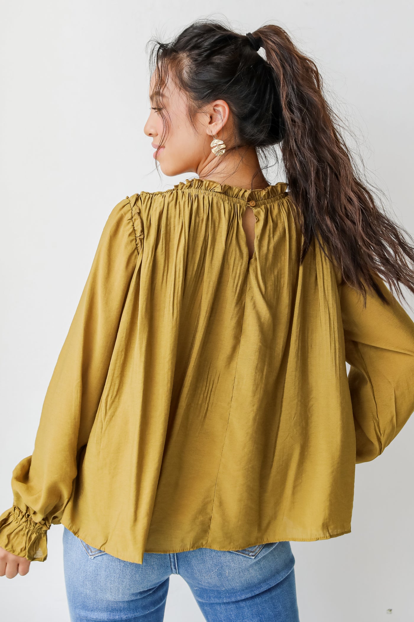 Blouse in mustard back view