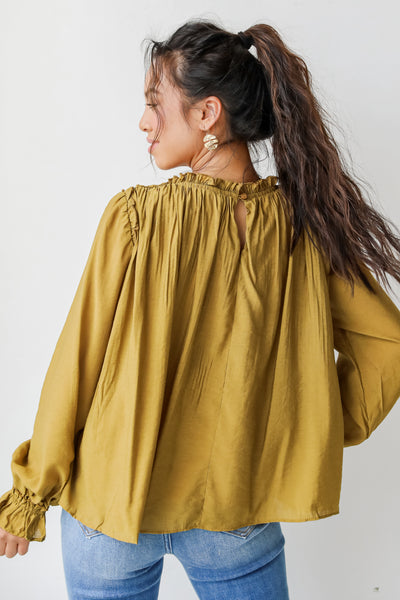Blouse in mustard back view