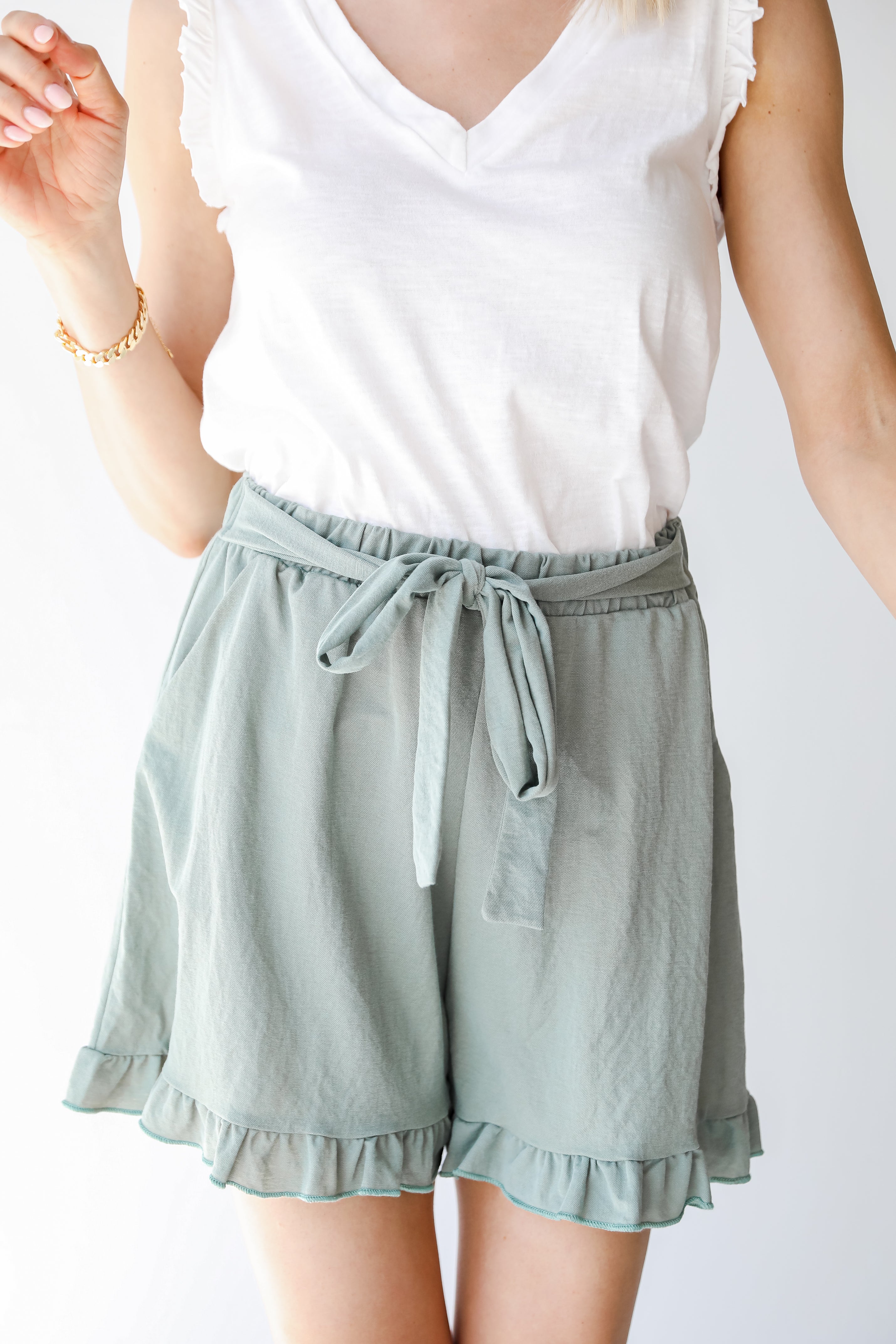 Shorts in sage on model