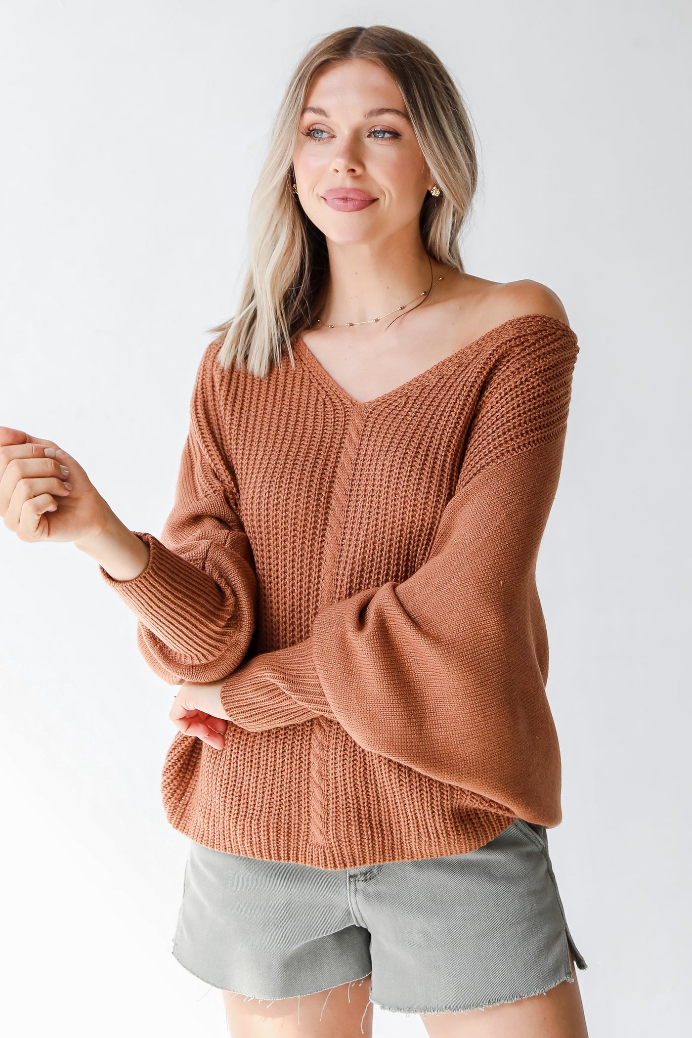 rust sweater on dress up model