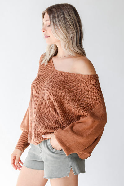 rust sweater side view