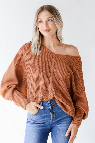 rust sweater on model with jeans