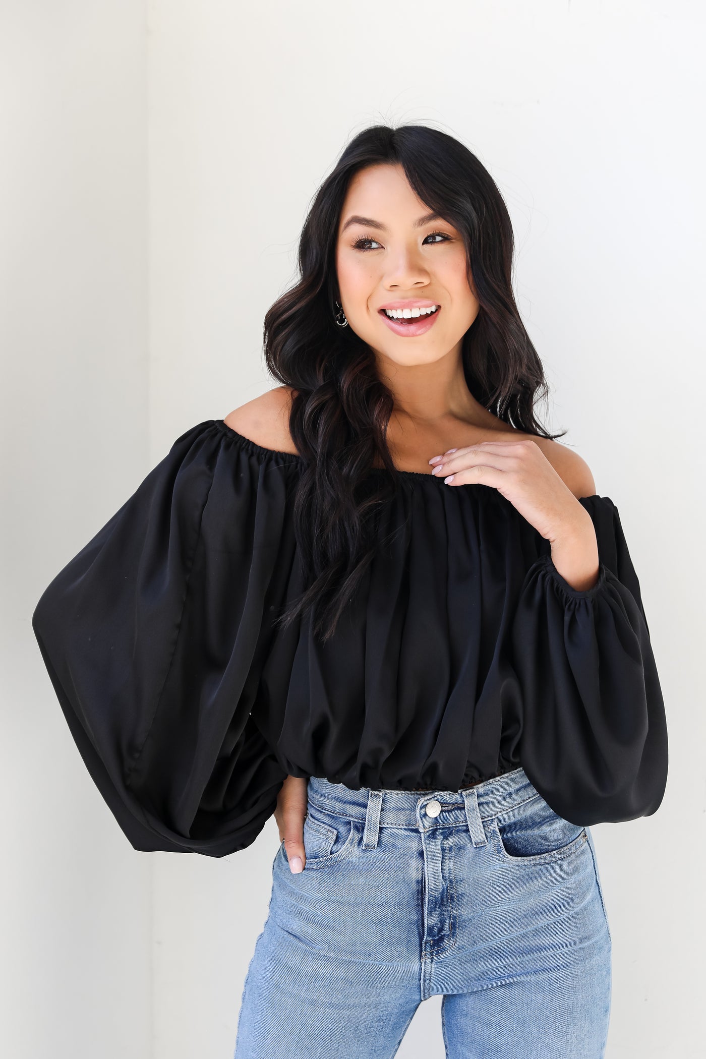 black satin blouse on model