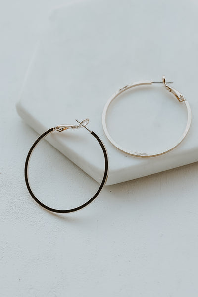 Textured Small Hoop Earrings flat lay in gold