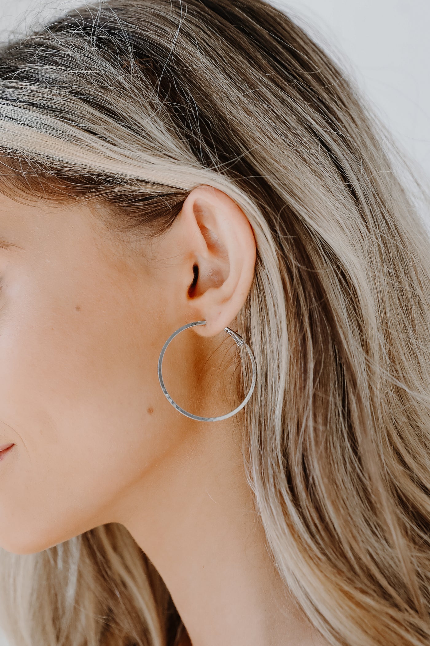 Textured Small Hoop Earrings in gold on model