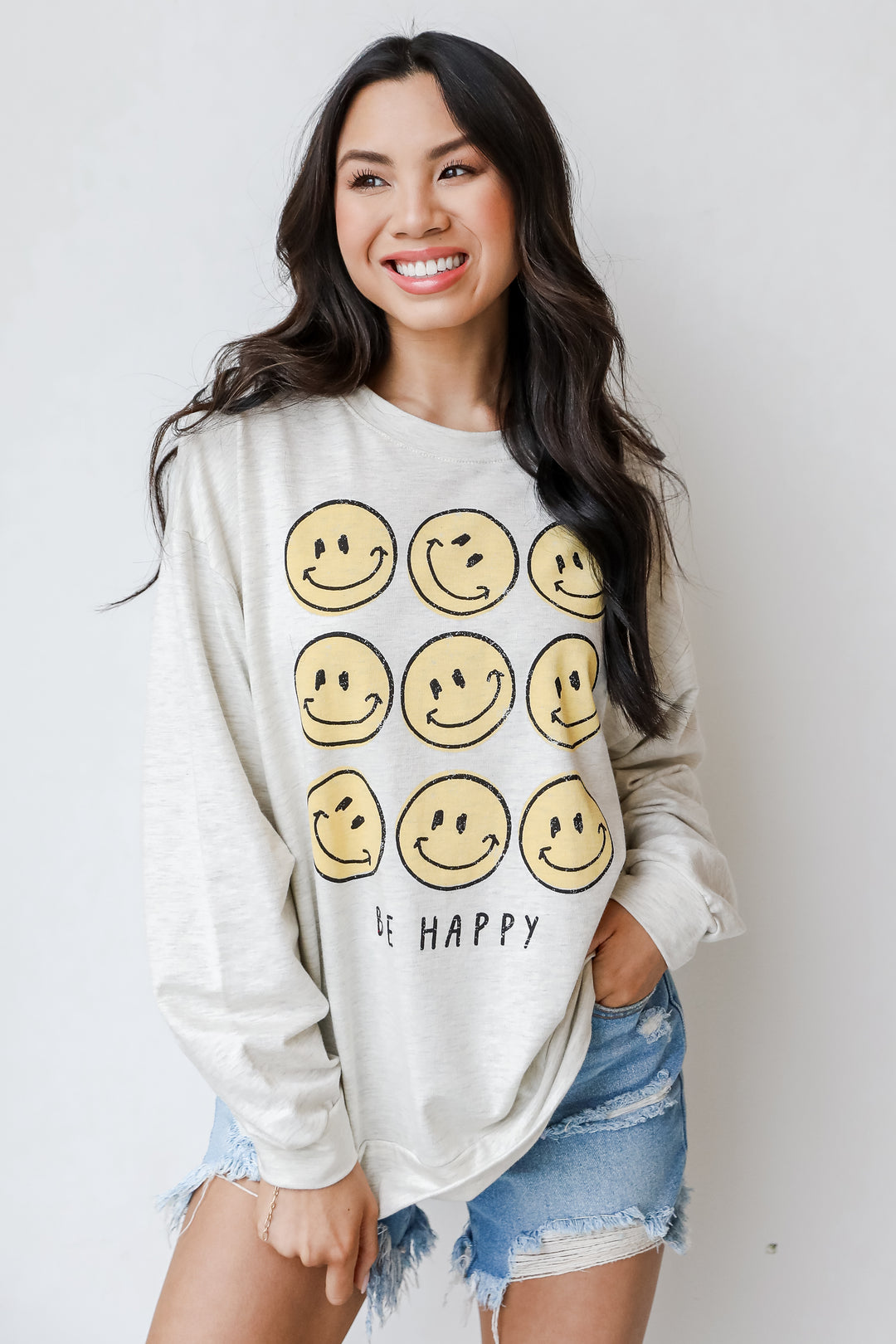 Be Happy Smiley Face Pullover on model