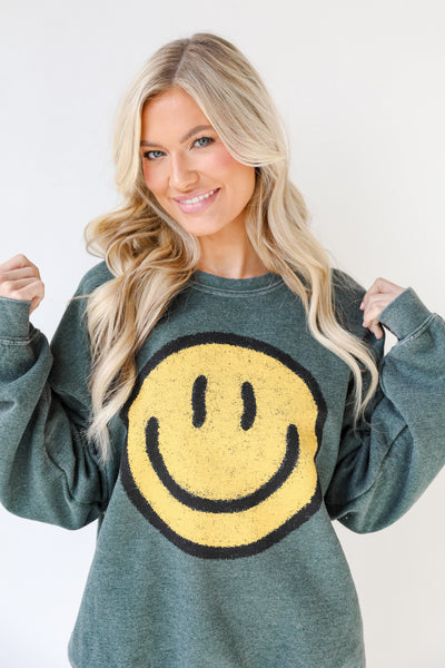 Smiley Face Oversized Pullover in hunter green on model
