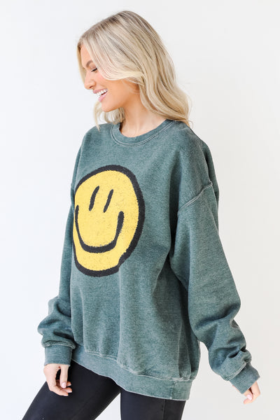 Smiley Face Oversized Pullover in hunter green side view