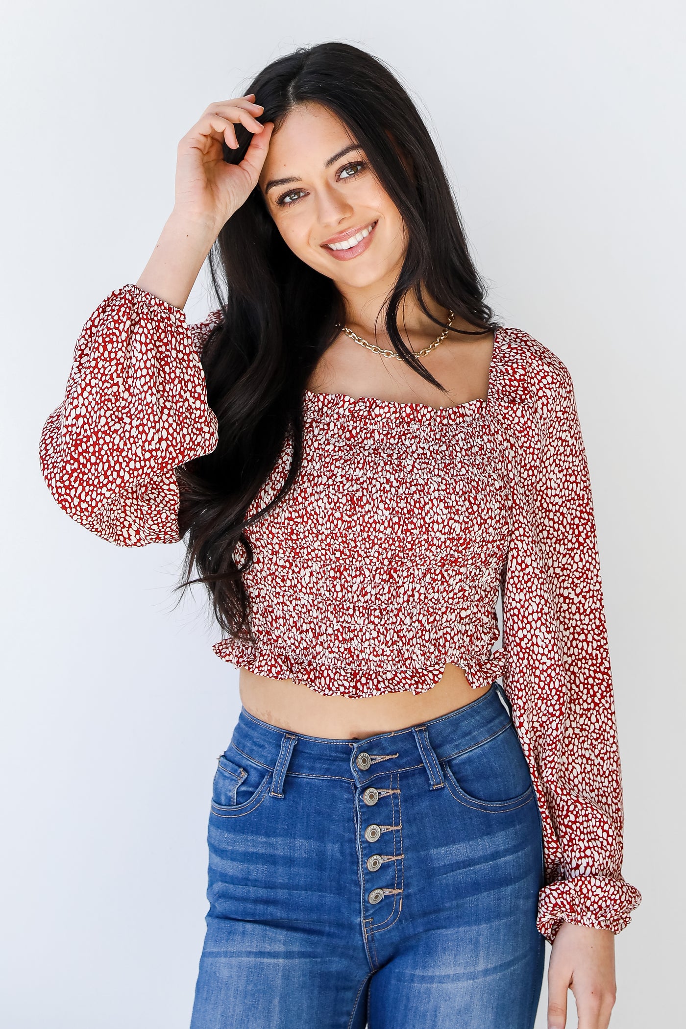 Smocked Cropped Blouse in brick on model
