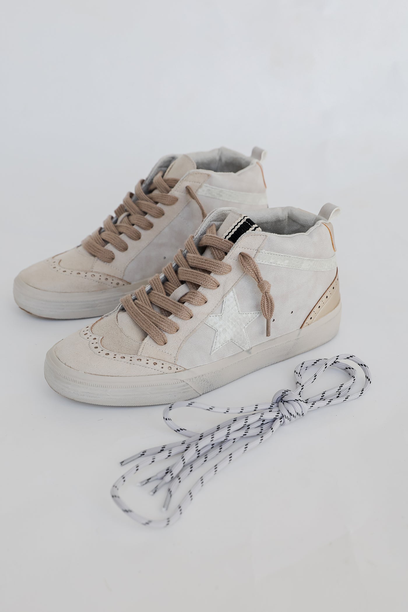 High Top Star Sneakers flat lay