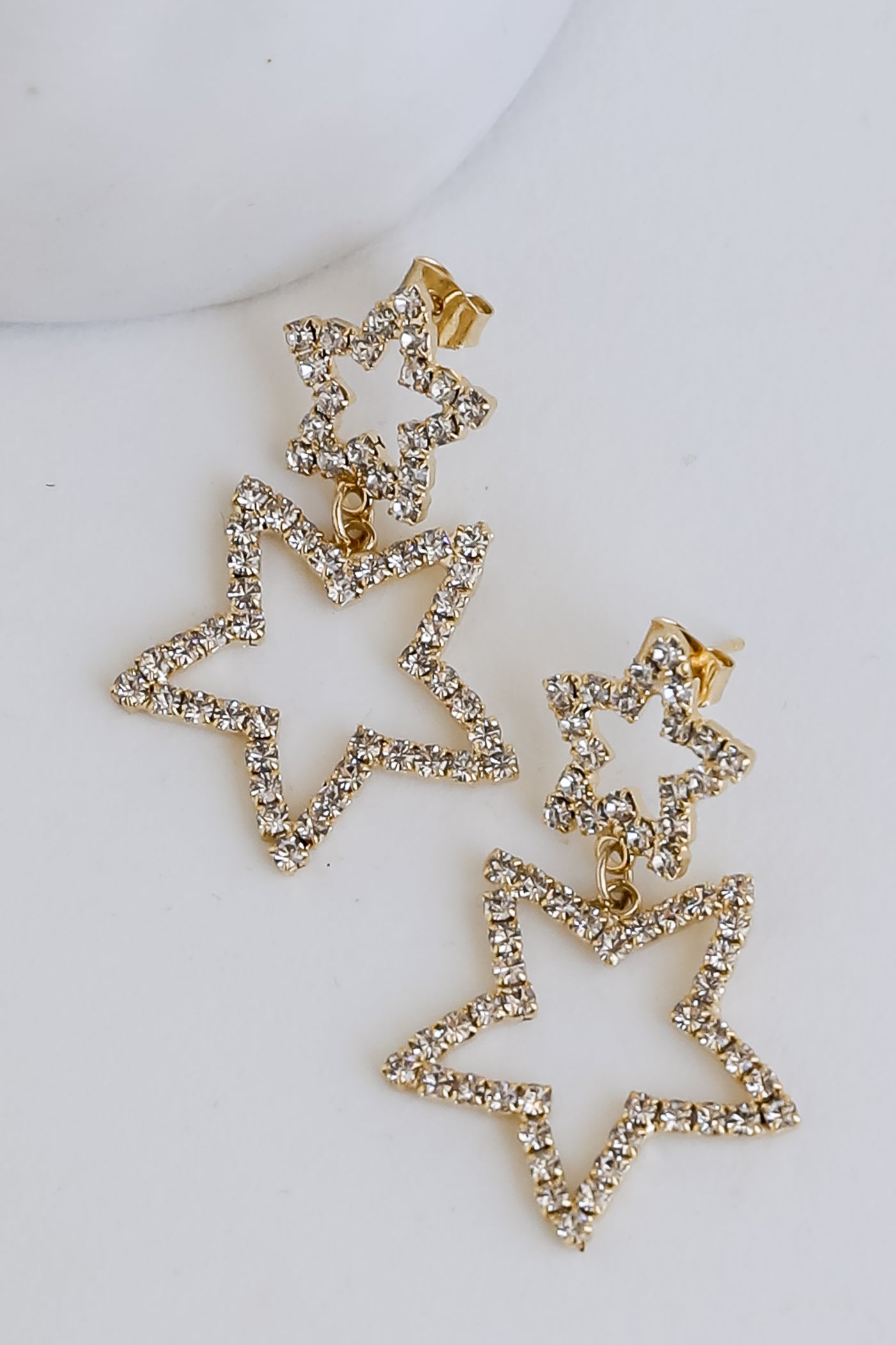 Gold Rhinestone Star Drop Earrings flat lay