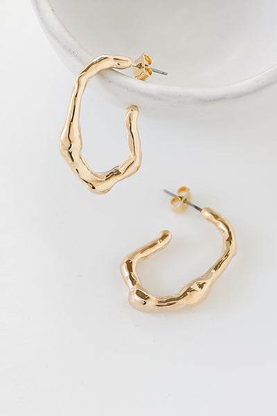 Gold Abstract Hoop Earrings flat lay