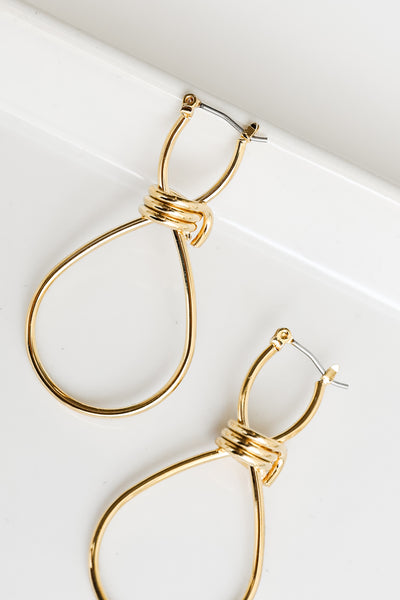 close up view of gold earrings