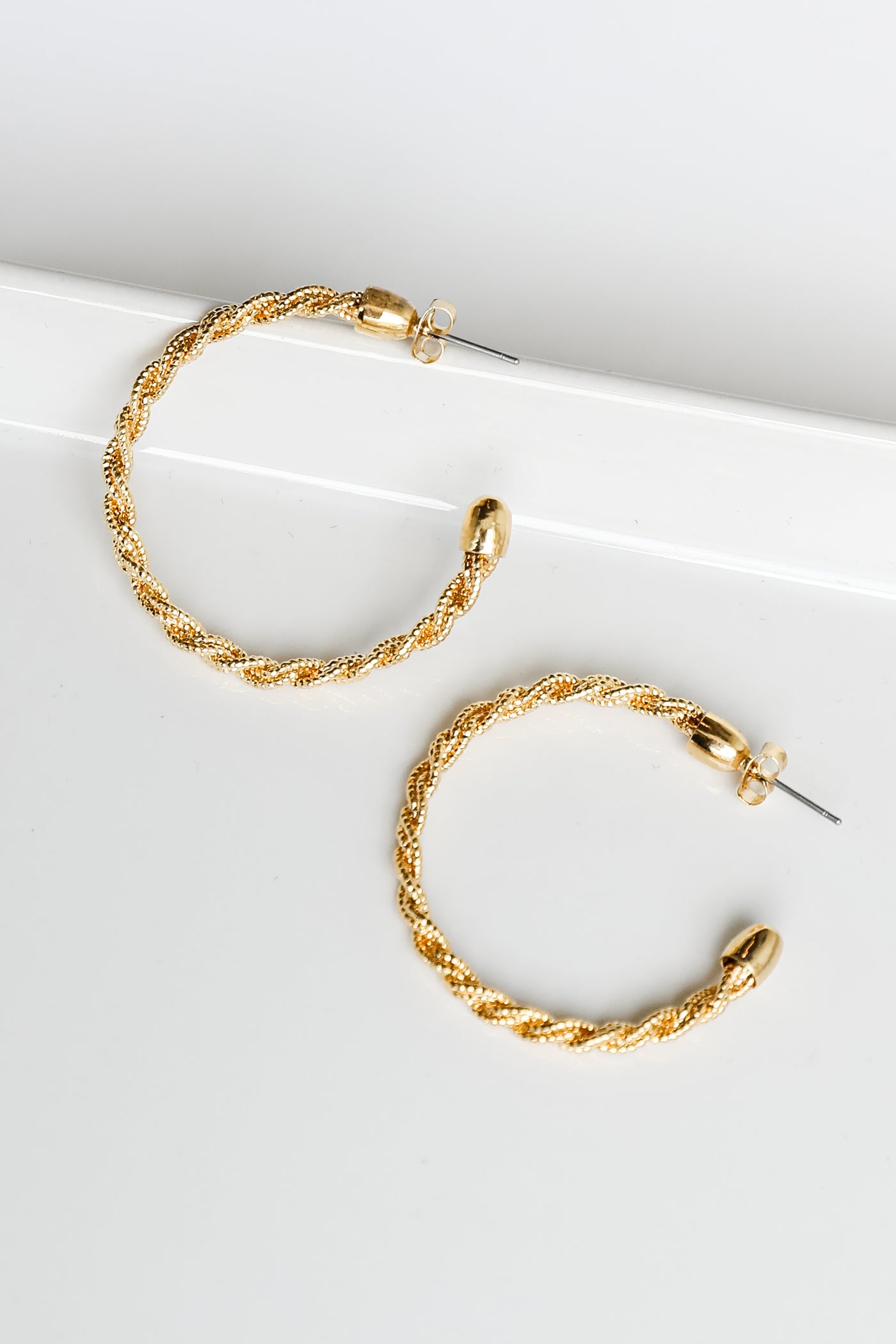 flat lay of gold hoops