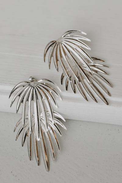 Firework Earrings in silver flat lay