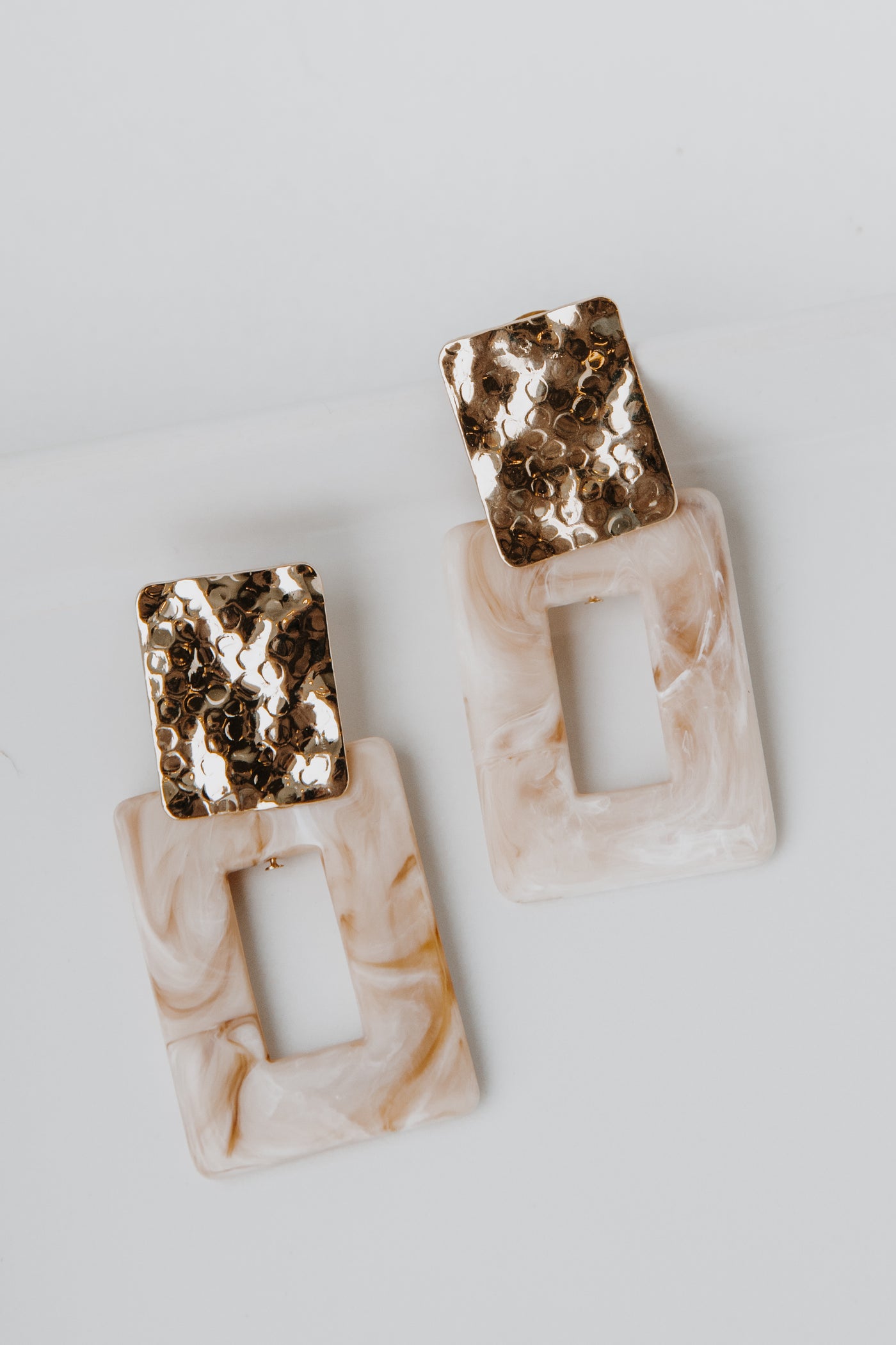 Acrylic Statement Earrings in ivory flat lay