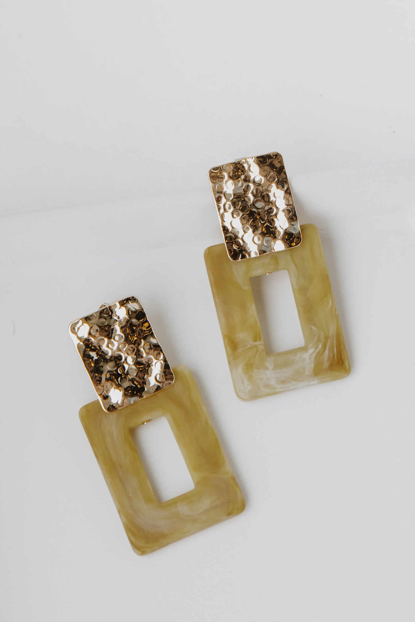 Acrylic Statement Earrings in taupe flat lay