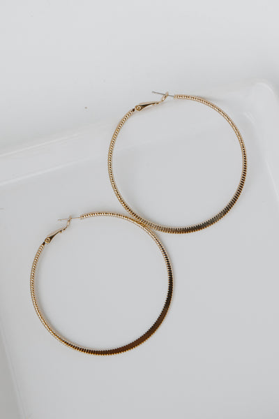 Gold Textured Medium Hoop Earrings from dress up