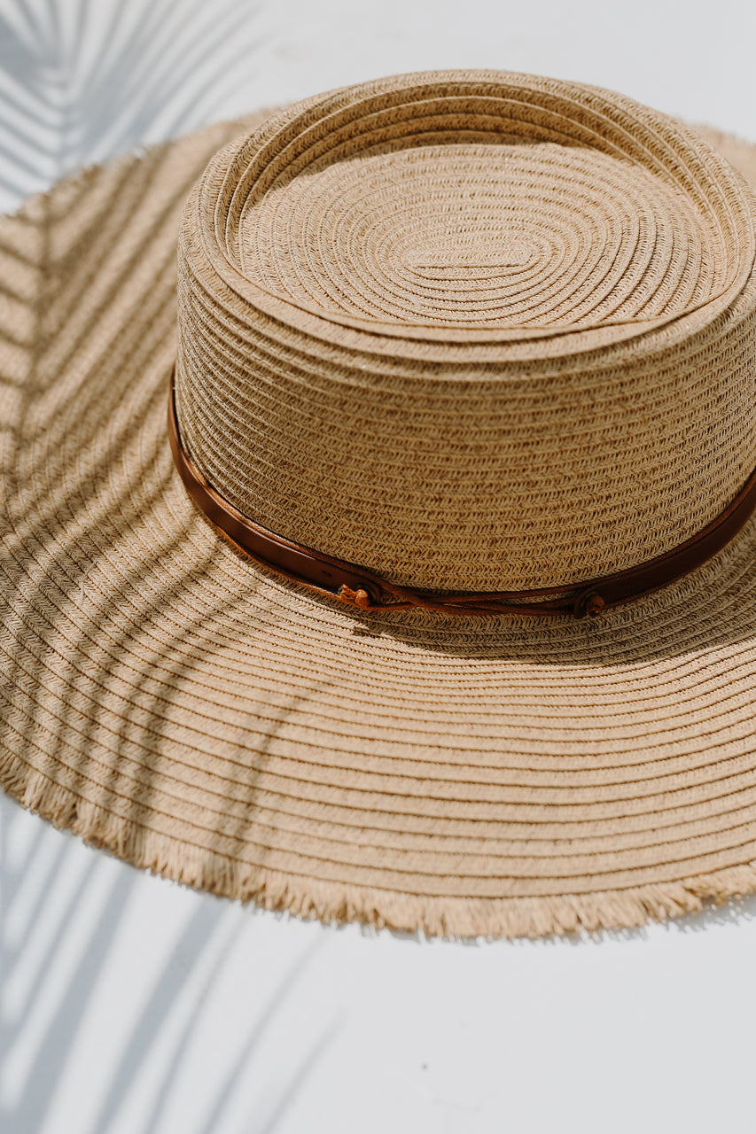 Frayed Straw Boater Hat flat lay close up