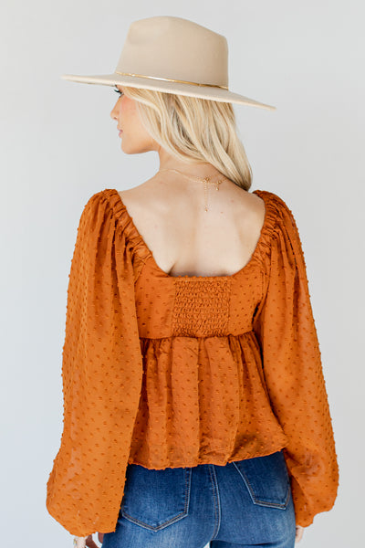 Swiss Dot Babydoll Blouse in rust back view