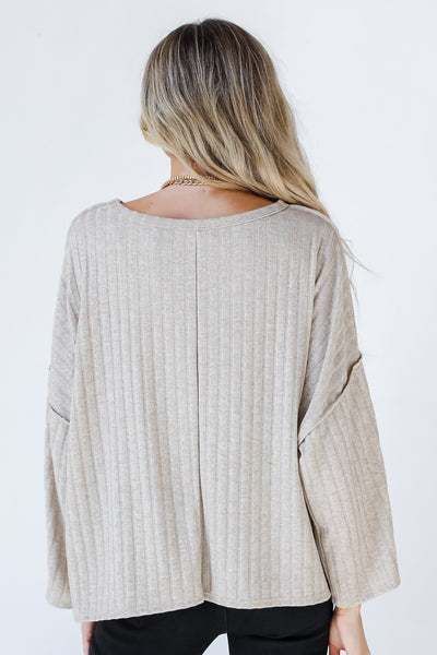 model wearing cute taupe ribbed knit top shopdressup dress up back view