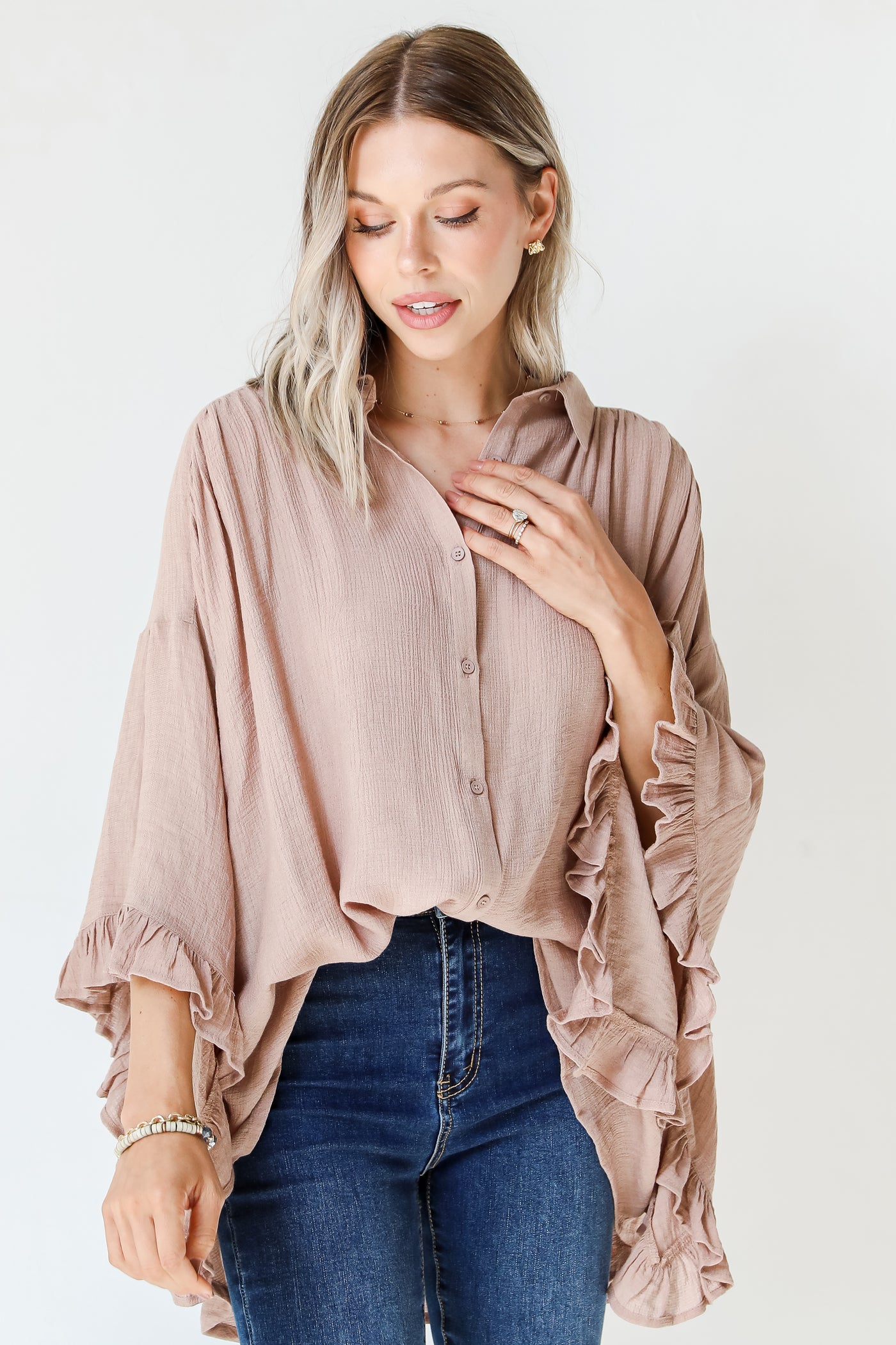 taupe ruffle blouse on model