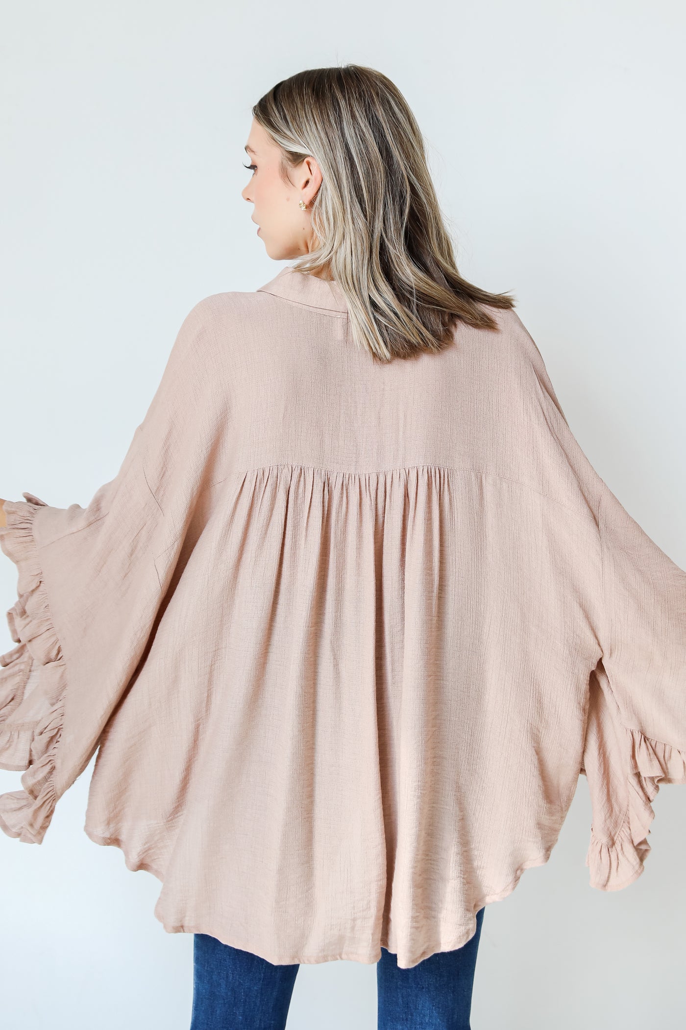 taupe ruffle sleeve blouse back view