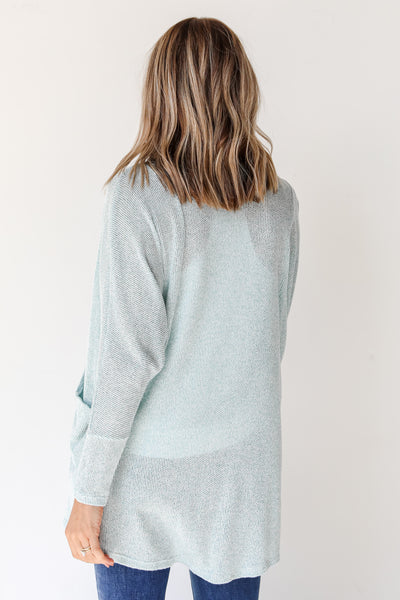 back view of a blue cardigan