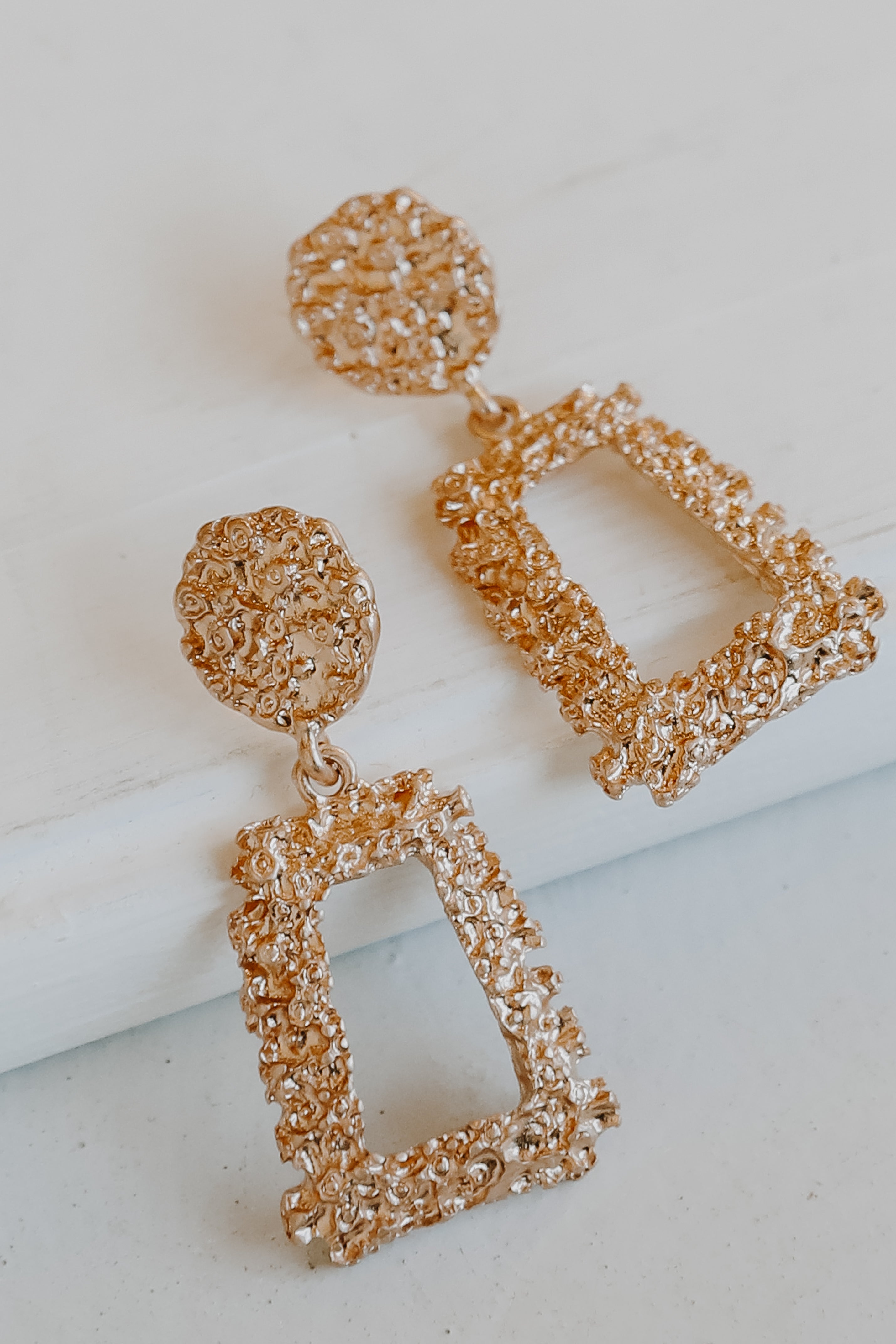 Gold Textured Drop Earrings flat lay