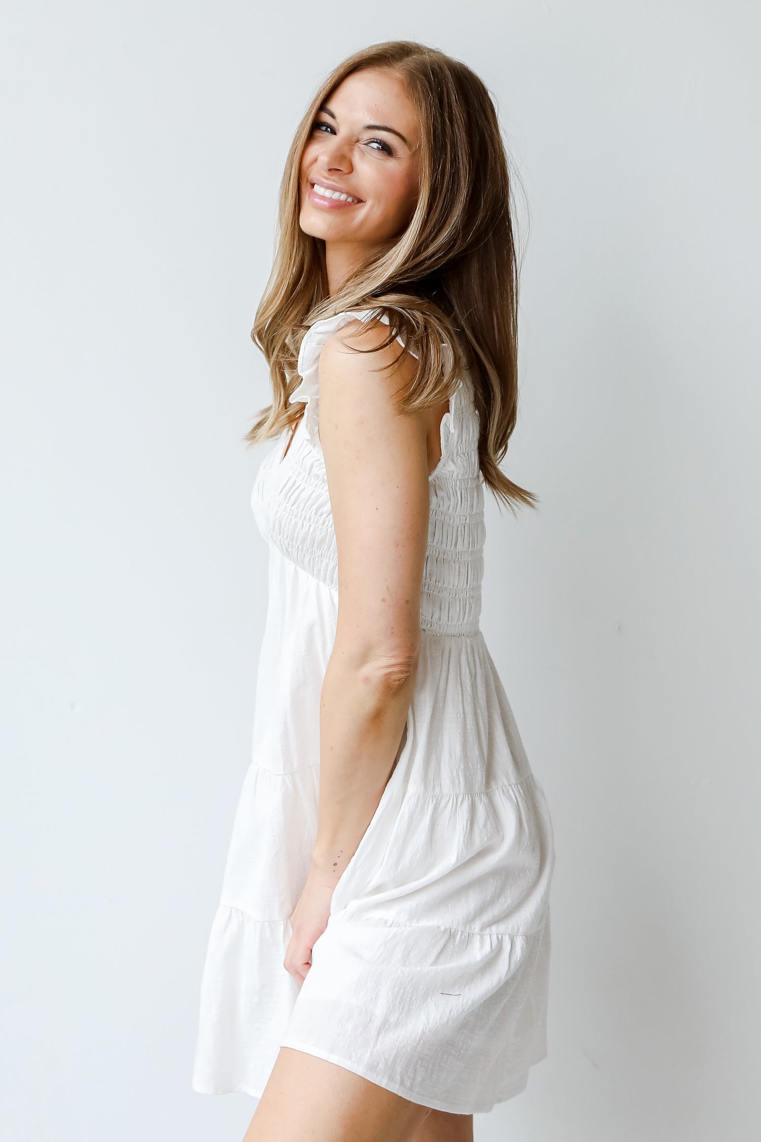 Smocked Tiered Mini Dress in ivory side view