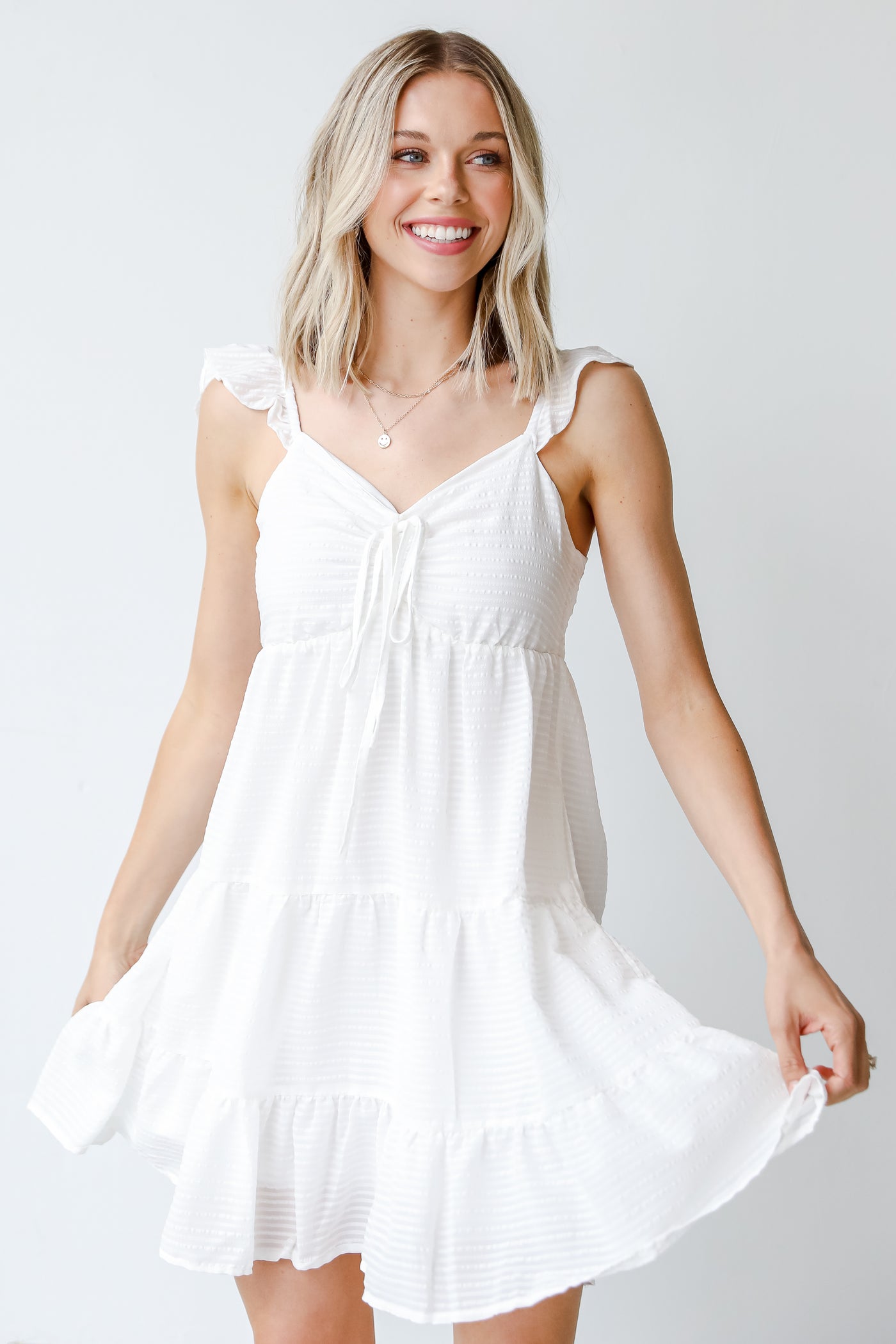Tiered Mini Dress in white on model