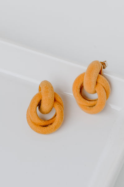 Velvet Circle Drop Earrings in mustard flat lay