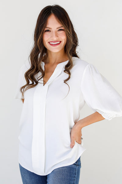 white puff sleeve blouse on model