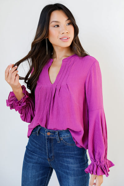 magenta flounce sleeve blouse on model