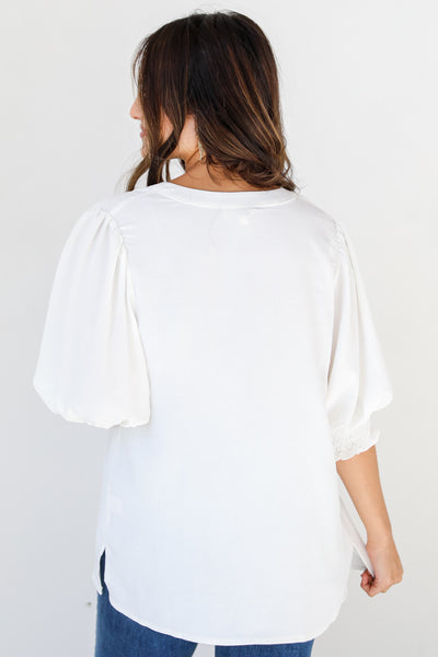 white puff sleeve blouse back view