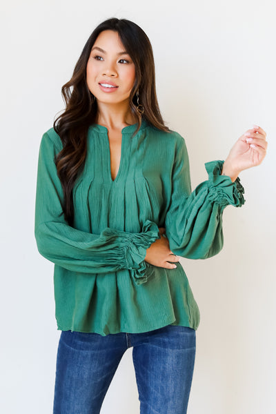 green flounce sleeve blouse