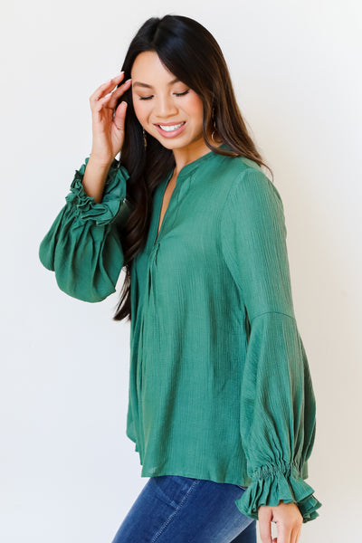 green flounce sleeve blouse side view