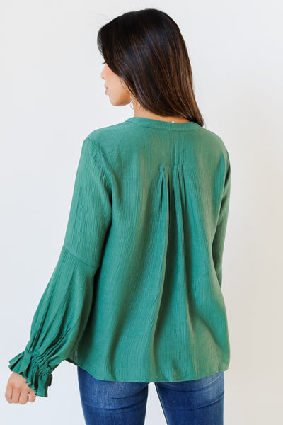 green flounce sleeve blouse back view