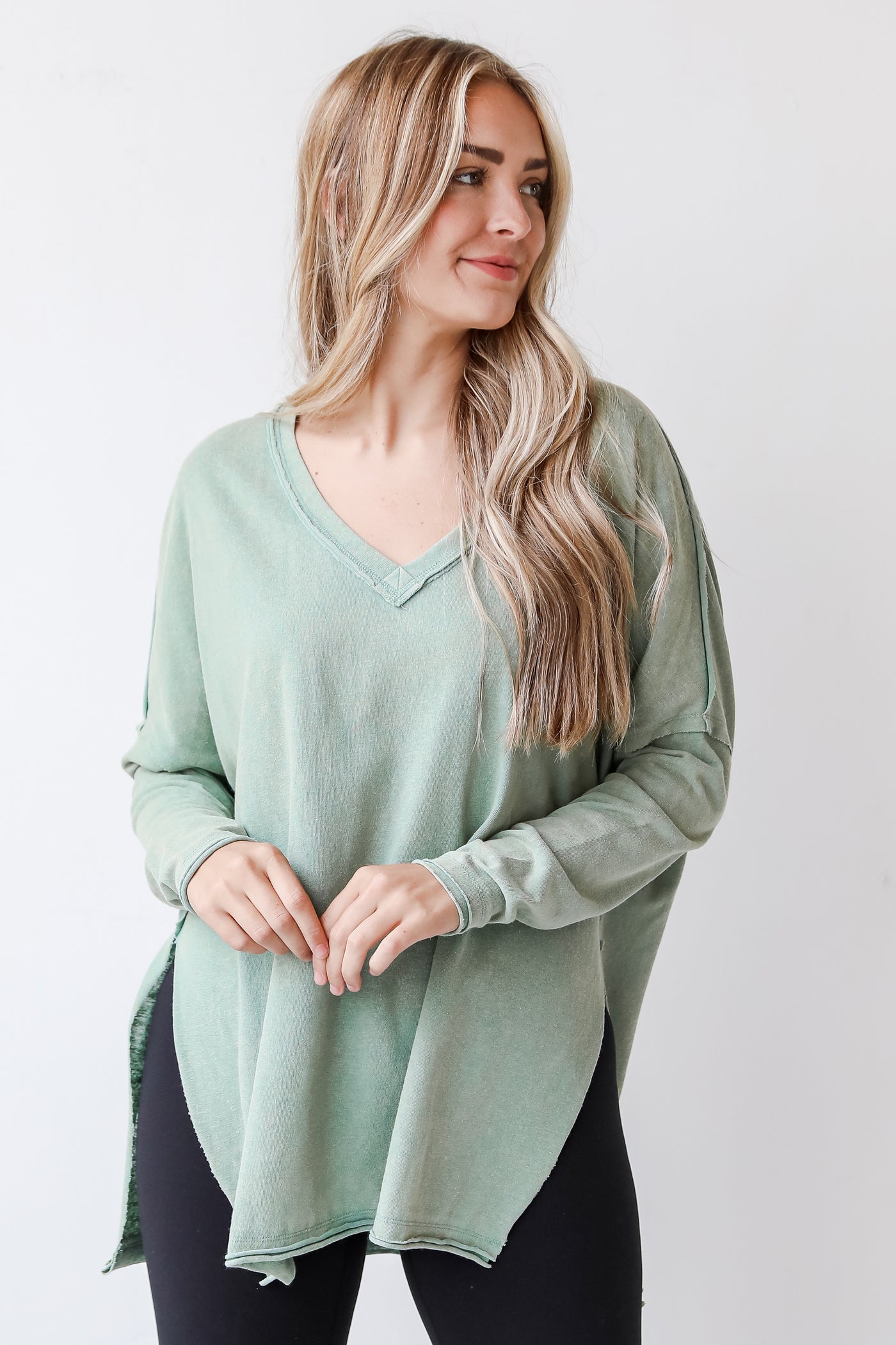 green knit top