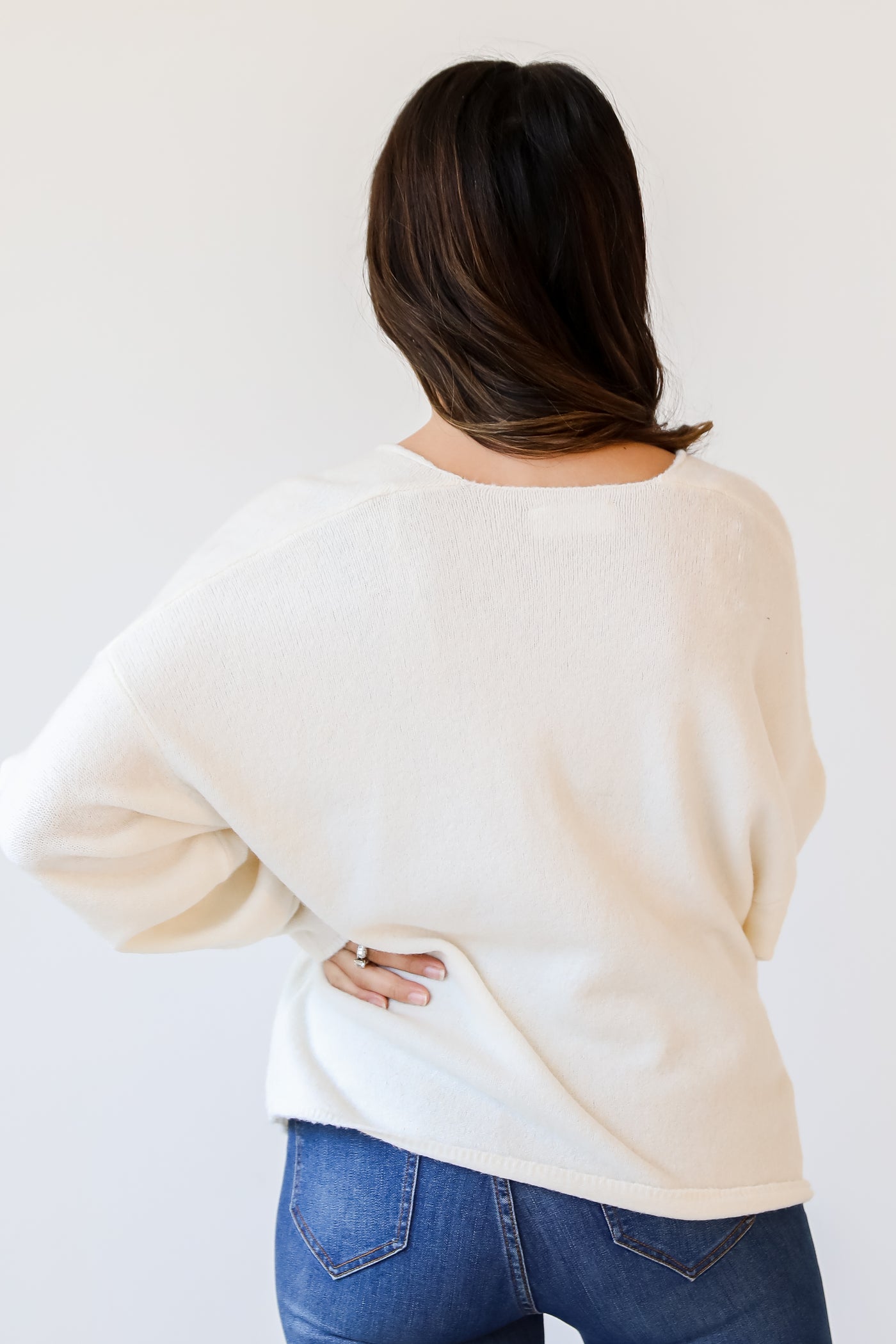 white Sweater back view