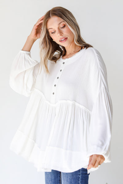 side view of a white Linen Babydoll Blouse