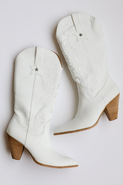 white Western Star Boots flat lay