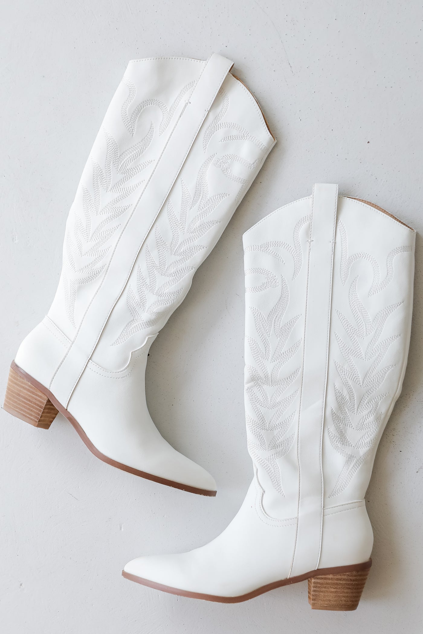 white Western Knee High Boots flat lay